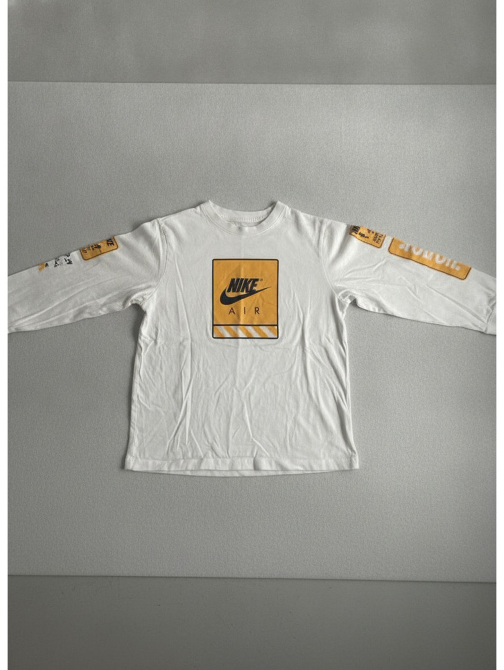 Nike Kid's White Long Sleeve T-Shirt with Yellow and Black Nike Air Graphics, Un